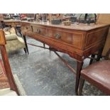 A LINE INLAID MAHOGANY THREE DRAWER SIDEBOARD, THE REEDED SQUARE LEGS TAPERING TO CASTER FEET, THE