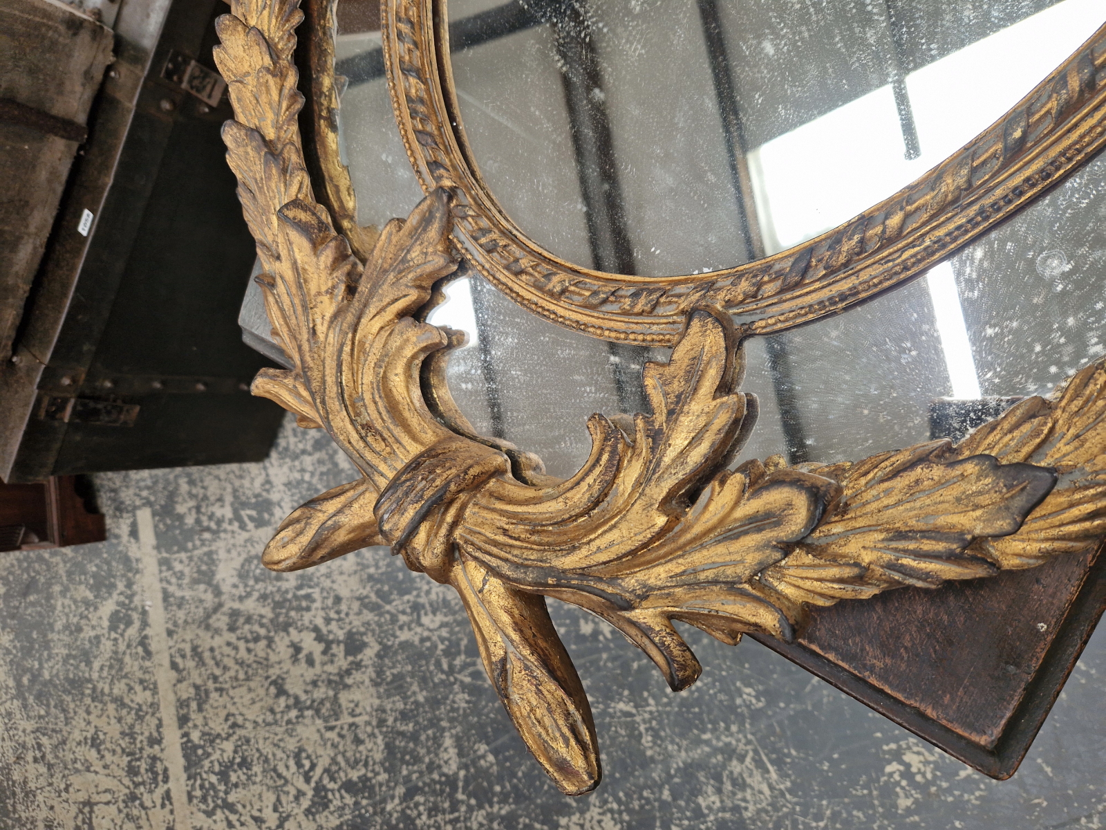 AN OVAL MIRROR WITHIN A FOLIATE GILT FRAME. 130 x 71cms. - Image 4 of 5