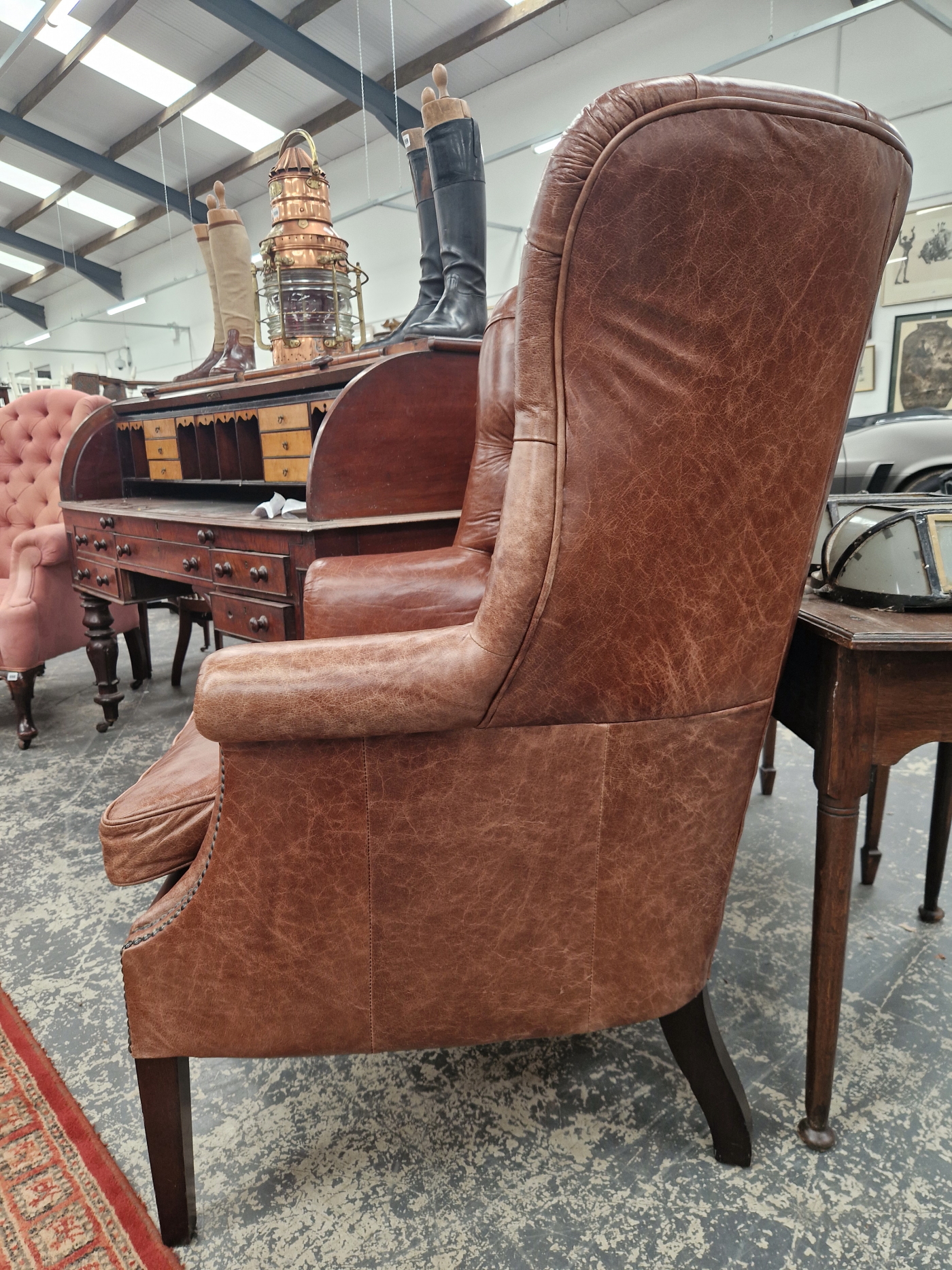 A MAHOGANY WING ARMCHAIR BUTTON UPHOLSTERED IN BROWN LEATHERETTE, CLOSE NAILING RUNNING FROM THE - Image 4 of 5