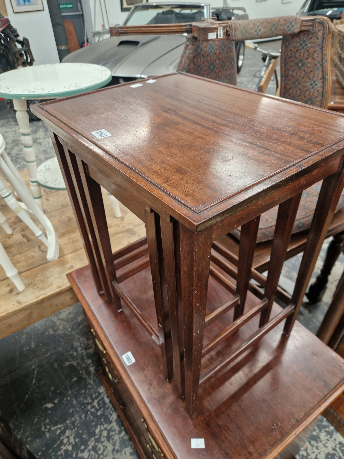 A NEST OF THREE CONTEMPORARY MAHOGANY COFFEE TABLES, EACH WITH RECTANGULAR TOPS. - Image 2 of 3