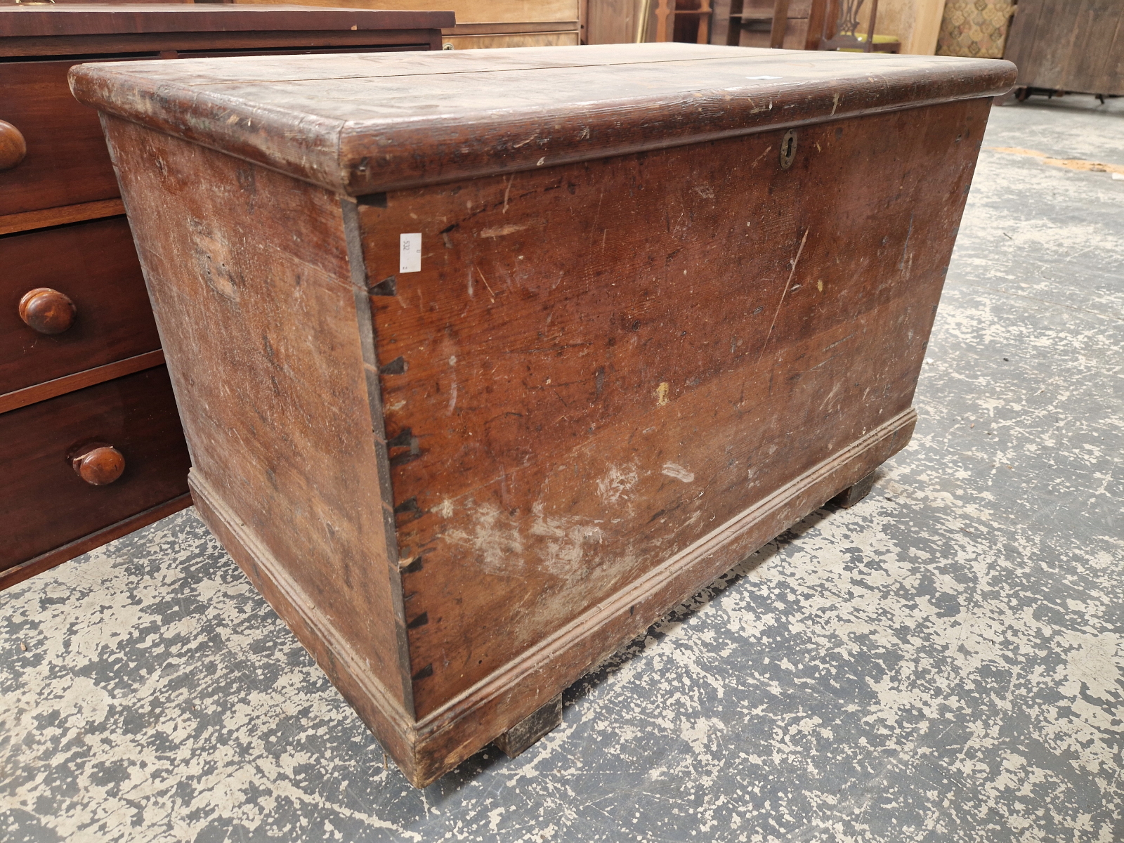 A STAINED PINE COFFER ON BAR FEET. W 100 x D 62 x H 65cms.