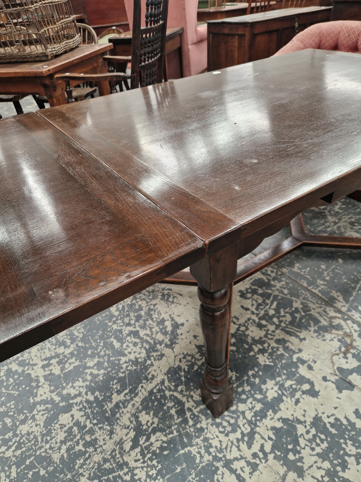 A CONTEMPORARY OAK DRAW LEAF TABLE, THE TURNED CYLINDRICAL LEGS JOINED BY A STRETCHER AT THEIR - Image 3 of 5