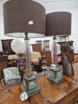 A PAIR OF GLASS REEDED COLUMN TABLE LAMPS ON BRONZE SQUARE SECTION BASES