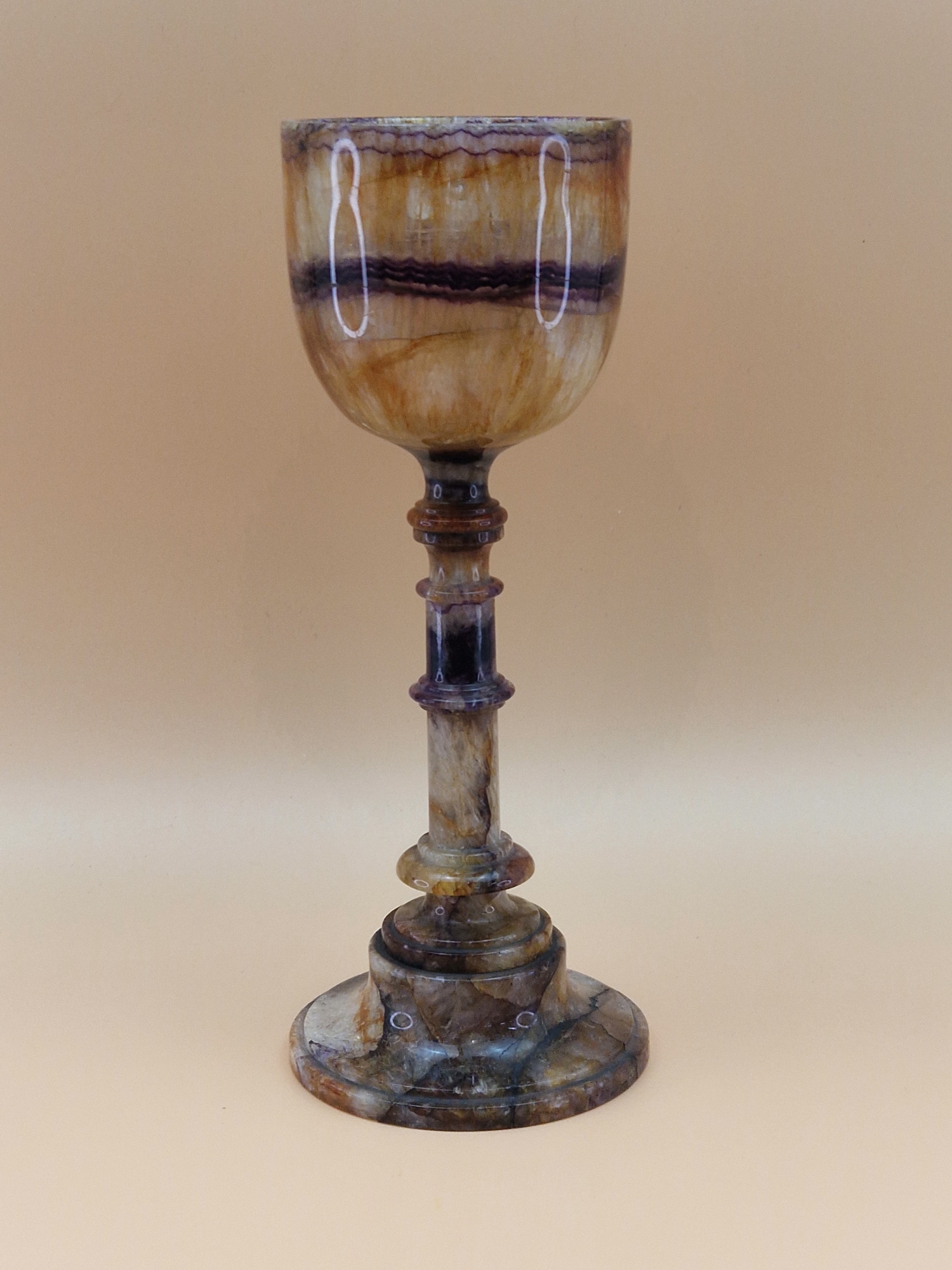 A BLUE JOHN GOBLET, THE BOWL WITH A CENTRAL PURPLE BAND AND RAISED ON A TURNED STEM WITH A