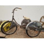 A RETRO CHILDS TRICYCLE.