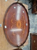 A BRASS HANDLED MAHOGANY OVAL TRAY INLAID WITH A CENTRAL PATERA WITHIN DRAPERY SWAGS