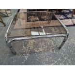 A PAIR OF RETRO CHROME FRAME COFFEE TABLES WITH SMOKE GLASS TOPS.