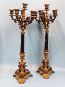 A PAIR OF 19th C. ORMOLU, BRONZE AND BLACK SLATE FIVE LIGHT CANDELABRA SUPPORTED ON TRIPARTITE