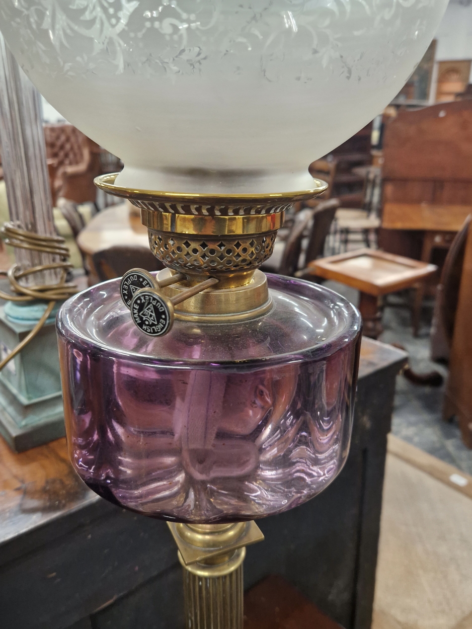 TWO OIL LAMPS WITH COLOURED GLASS RECEIVERS ON REEDED BRASS COLUMNS AND TOGETHER WITH A MARBLE AND - Image 6 of 9
