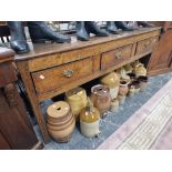 A 19th C. OAK DRESSER BASE WITH THREE DRAWERS ABOVE THE SQUARE SECTIONED LEGS. W 179 x D 46 x H