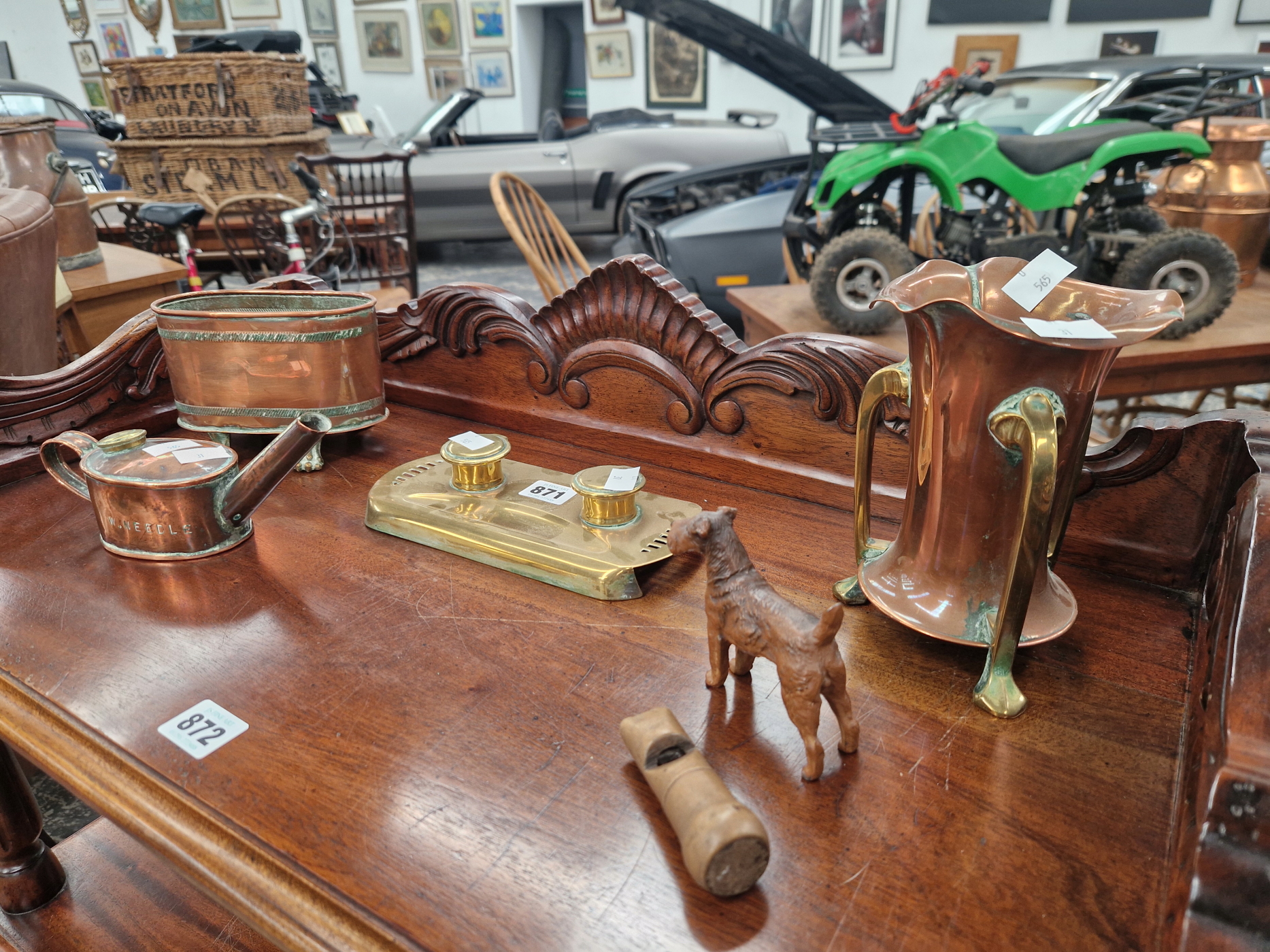 A BRASS INKSTAND, TWO COPPER VASES, A COPPER OIL POURER, A COLD PAINTED AIREDALE AND A WOODEN