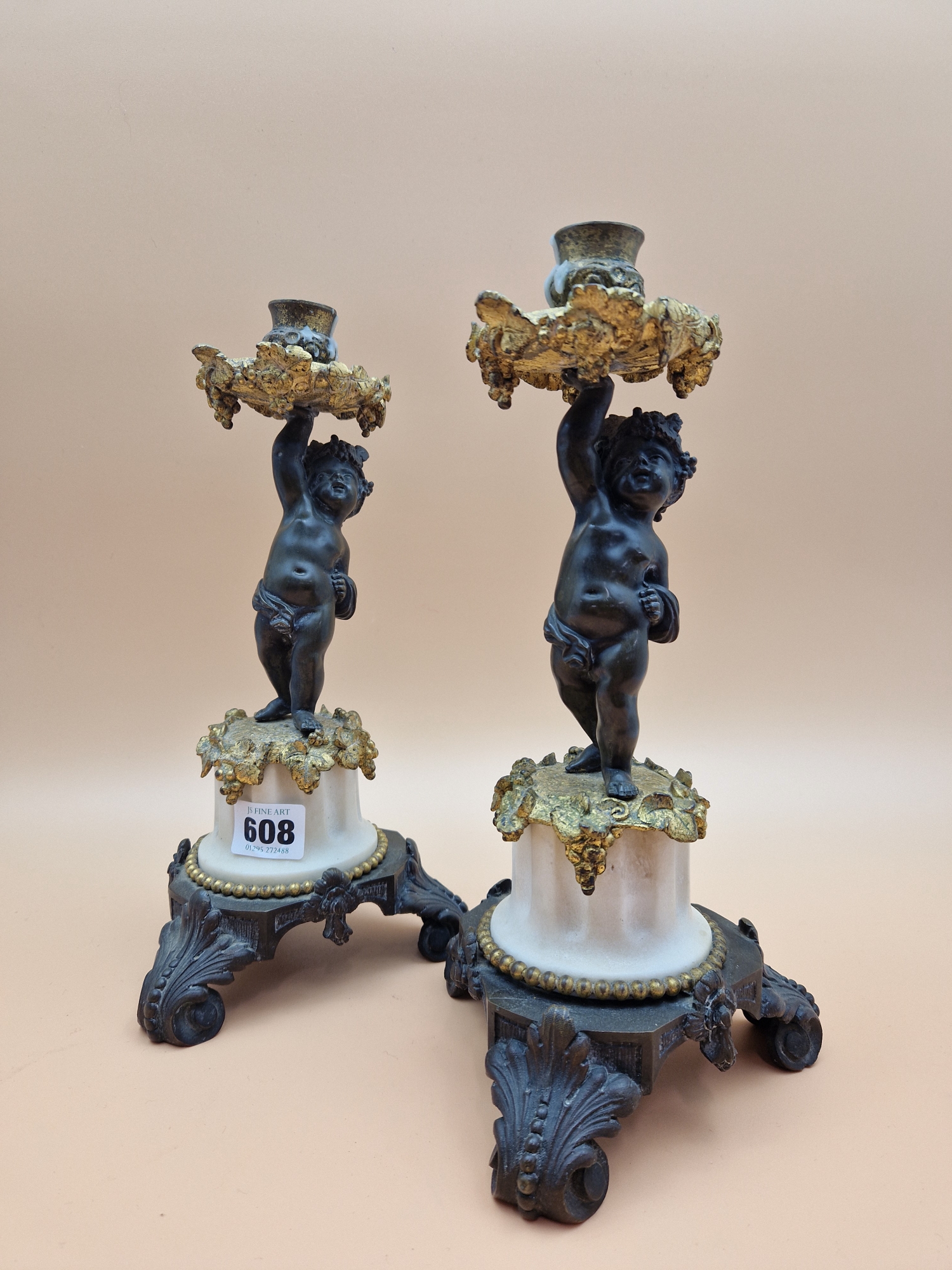 A PAIR OF LATE 19th C. BRONZE, ORMOLU AND WHITE MARBLE CANDLESTICKS HELD UP BY PUTTI STANDING ON - Image 3 of 5