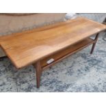 A VINTAGE MID CENTURY TEAK COFFEE TABLE WITH UNDER TIER.
