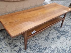 A VINTAGE MID CENTURY TEAK COFFEE TABLE WITH UNDER TIER.