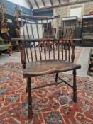 AN 18TH / 19TH CENTURY COUNTRY MADE WINDSOR TYPE STICK BACK CHAIR WITH PLAIN CREST RAIL AND SHAPED