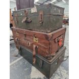 A GREEN AND A BLACK METAL TRUNK TOGETHER WITH A BROWN CANVAS COVERED TRUNK