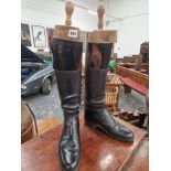 A PAIR OF LADYS BLACK LEATHER HUNTING BOOTS WITH PEAL & CO TREES TOGETHER WITH A PAIR OF CANVAS