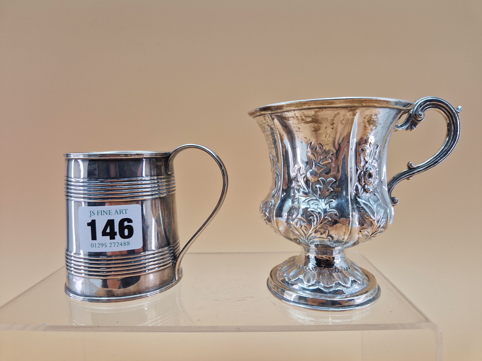 A VICTORIAN SILVER MUG BY WILLIAM HEWITT, LONDON 1838, EMBOSSED WITH FLOWERS TOGETHER WITH A QUARTER