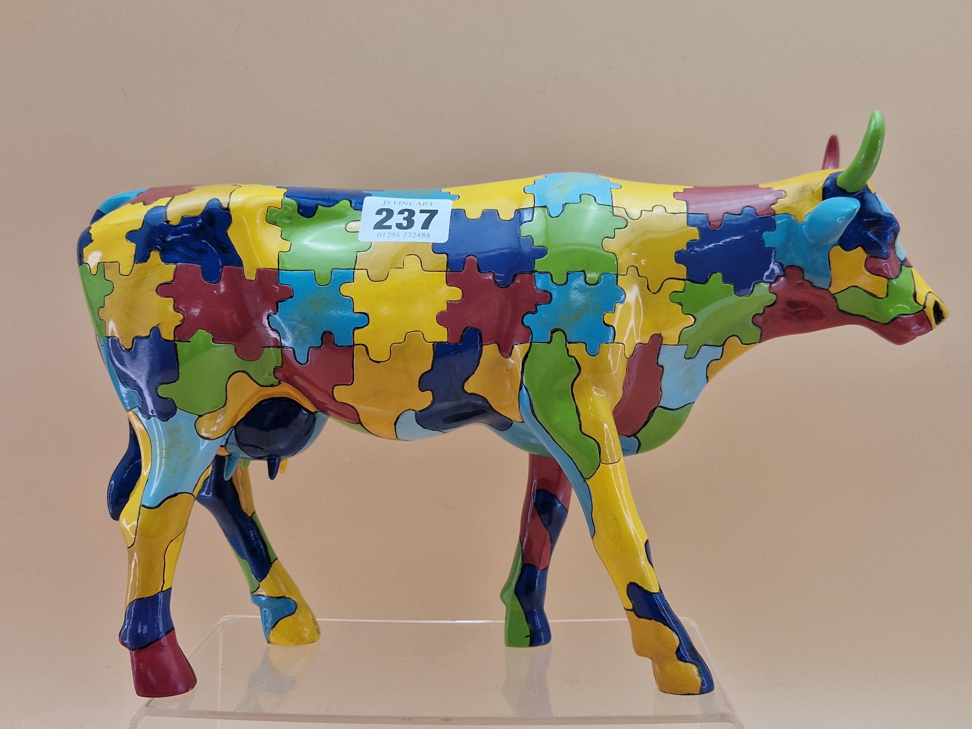 A RESIN PUZZLE COW, MADE IN 2002 BY COW PARADE HOLDINGS CORPOARTION. W 31cms