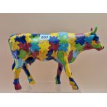 A RESIN PUZZLE COW, MADE IN 2002 BY COW PARADE HOLDINGS CORPOARTION. W 31cms