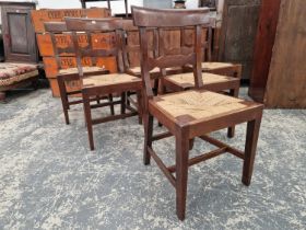 A SET OF SIX EARLY 19th C. OAK DINING CHAIRS WITH DROP IN RUSH SEATS