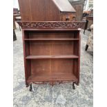 AN ANTIQUE MAHOGANY WALL SHELF WITH PIERCED CREST.