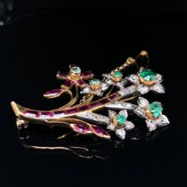 A 20th CENTURY DIAMOND, EMERALD AND RUBY SPRAY BROOCH. THE BROOCH UNHALLMARKED, ASSESSED VARIOUSLY