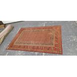 A MACHINE MADE CARPET OF FIGURAL TRIBAL DESIGN 300 x 202 cm