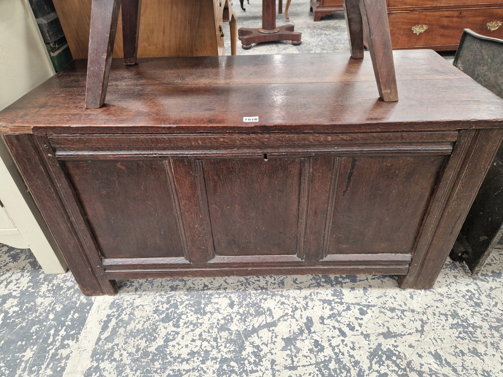 AN 18th C. OAK COFFER WITH A THREE PANELLED FRONT. W 109 x D 47 x H 56cms.