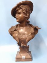 A BRONZED COMPOSITION BUST LABELLED LA CANOTIERE PAR DUTRION, SHE WEARS A CAP AND HAS ANCHORS ON THE