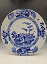 A LATE 18th C. CHINESE BLUE AND WHITE CHARGER PAINTED CENTRALLY WITH PEONY AND BAMBOO GROWING