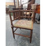 A VICTORIAN BOBBIN TURNED CORNER CHAIR.