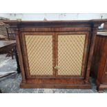 A VICTORIAN ROSEWOOD SIDE CABINET WITH COLUMNS FLANKING THE GRILLED DOORS, EGG AND DART BANDS