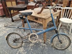 A MOULTON BLUE STOWAWAY BICYCLE