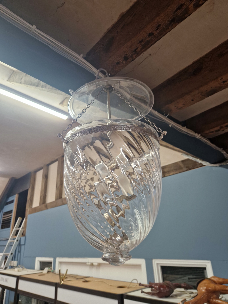 A THREE SOCKET CEILING LIGHT IN A CLEAR GLASS BOWL AND SHADED BY AN ORIENTAL STRAW HAT SHAPE. Dia.