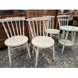 A SET OF FOUR WHITE PAINTED YOKE BACKED KITCHEN CHAIRS DETAILED IN TURQUOISE AND ENSUITE WITH A