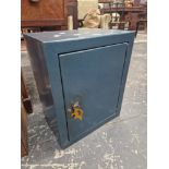A STRONG BOX WITH A BLUE METALLIC FINISH AND KEYS TO THE DOOR