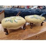 A PAIR OF ROSEWOOD FOOTSTOOLS WITH YELLOW GROUND FLORAL NEEDLE WORK SEATS