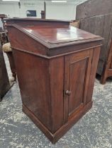 A VICTORIAN MAHOGANY DAVENPORT FORM LIFT TOP WASHSTAND WITH FITTED INTERIOR.