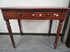 A 19th C. MAHOGANY TWO DRAWER TABLE WITH A RECTANGULAR TOP ON TURNED CYLINDRICAL LEGS WITH SPINDLE