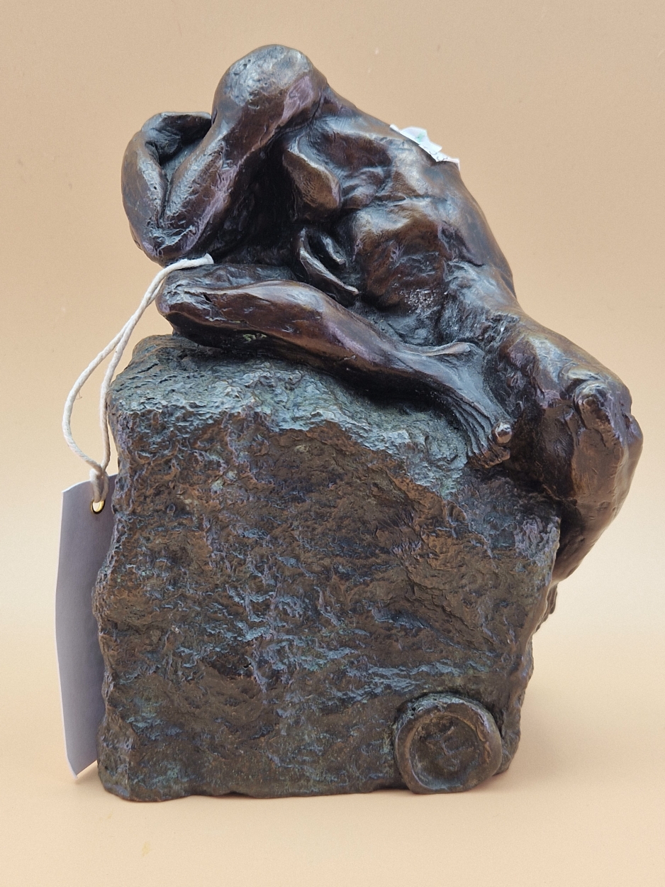 FELIPE GONZALEZ, A CONTEMPORARY BRONZE SCULPTURE OF A NAKED MAN CROUCHED ON A ROCK. H 18cms.