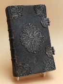 MAROT AND DE BEZE, LES PSEAUMES DE DAVID, 1667, SILVER FILIGREE AND CLASP MOUNTED LEATHER BINDING.
