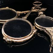 A PAIR OF ANTIQUE UNHALLMARKED, ASSESSED AS 9ct GOLD FOLDING LORGNETTE AND TWO OTHER PLATED PAIRS.
