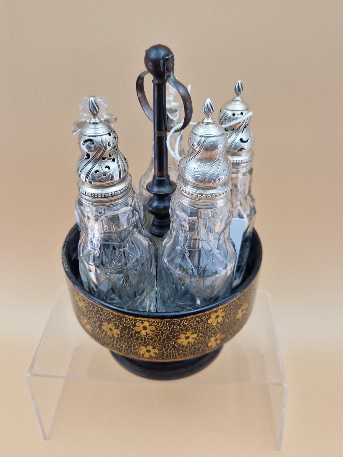 A FLORAL GILT BLACK PAPIER MACHE CRUET STAND WITH FIVE CUT GLASS BOTTLES WITH WHITE METAL MOUNTS, - Image 3 of 8