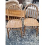 A PAIR OF ERCOL HOOP BACK CHAIRS.