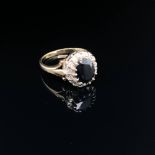 A HALLMARKED 9ct GOLD SAPPHIRE AND DIAMOND CLUSTER RING. FINGER SIZE N. WEIGHT 3.33grms.