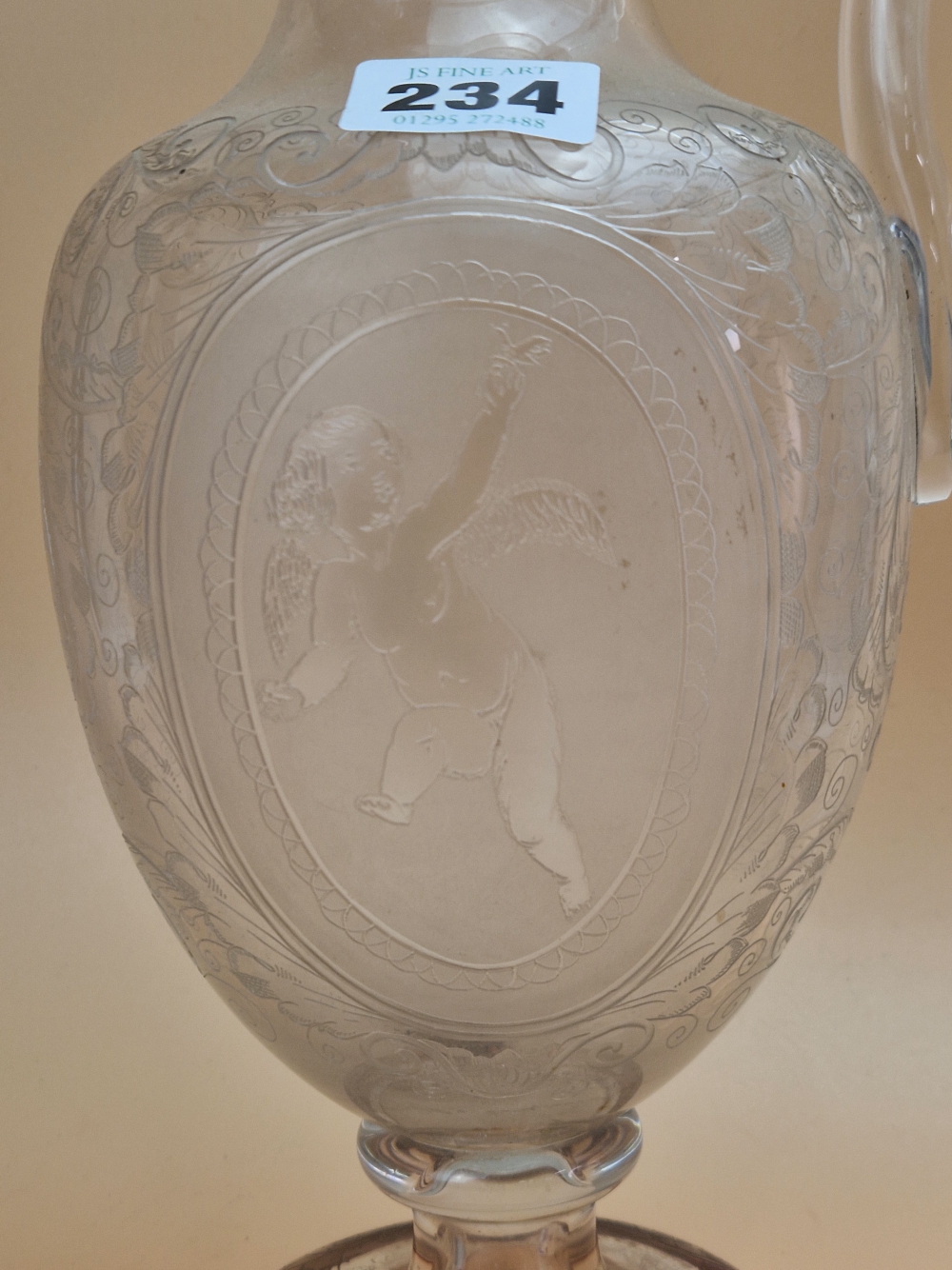 A CLEAR GLASS BALUSTER EWER ETCHED WITH CUPID OVALS AND WITH A CRANBERRY TRAILED RIM AND FOOT, A - Image 3 of 14