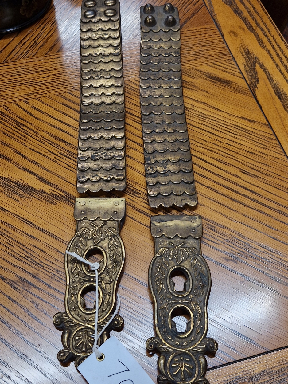 A PAIR OF LEATHER LINED BRASS FLEXIBLE STRAPS TO FIX A LIFE GUARDS CUIRASS OVER HIS SHOULDERS
