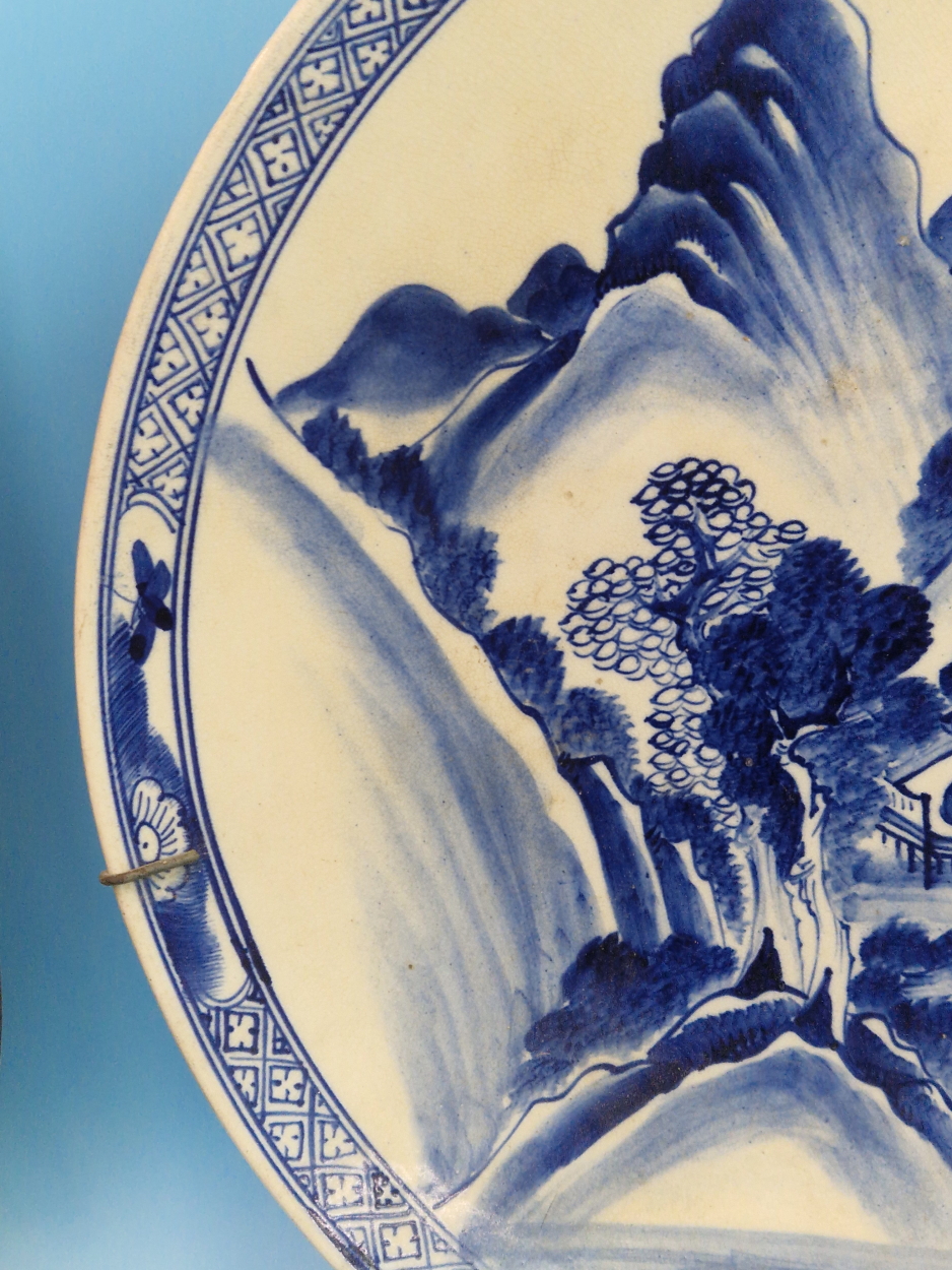 A PAIR OF CHINESE BLUE AND WHITE CHARGERS PAINTED WITH MOUNTAINOUS ISLANDS, A BUFFALO ON ONE AND A - Image 9 of 14