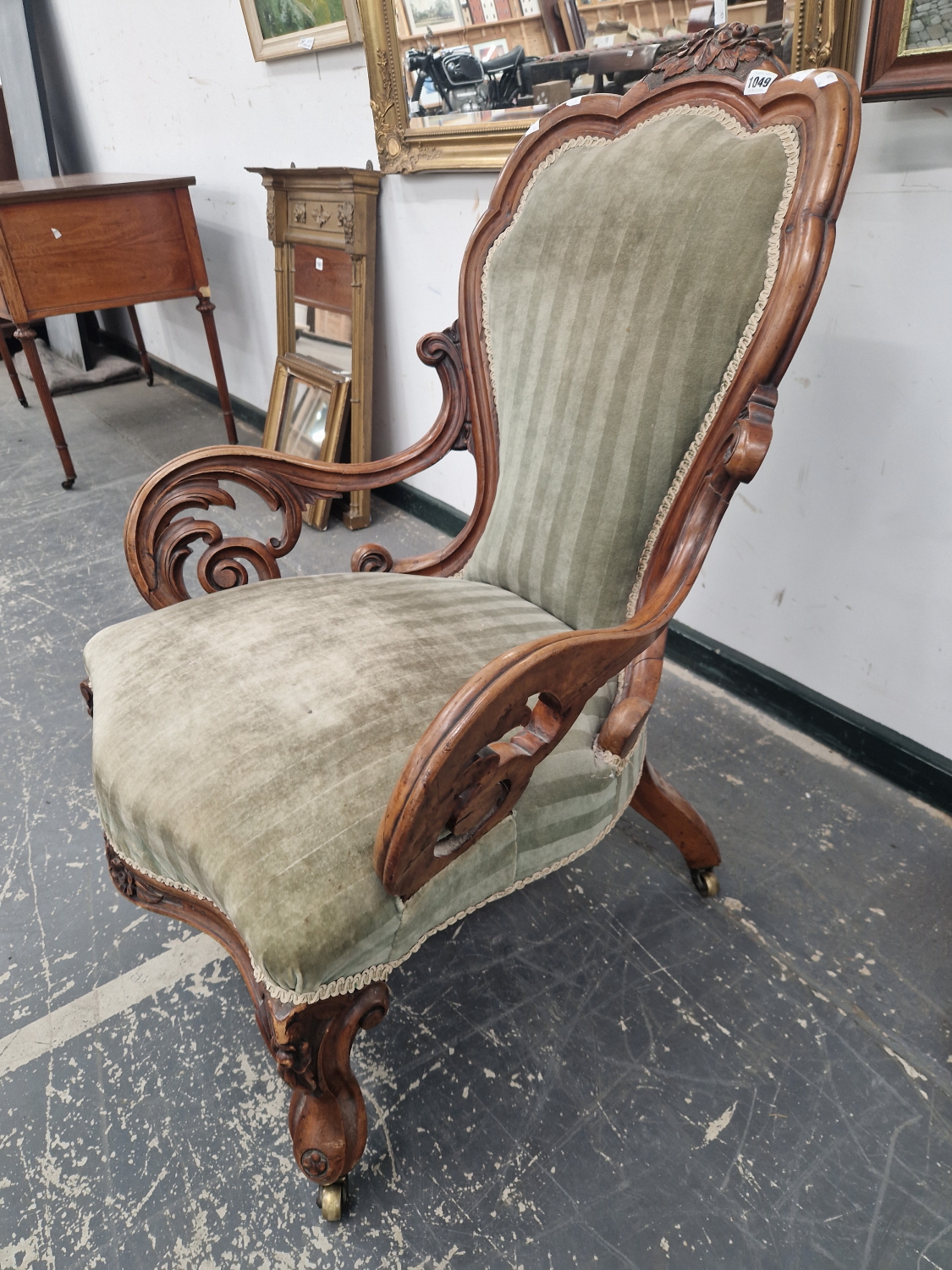 A VICTORIAN WALNUT SHOW FRAME ARMCHAIR CRESTED BY A PAIR OF CARVED FLOWER HEADS THE ARMS SUPPORTED - Image 3 of 3